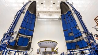 NASA's Mars 2020 Perseverance rover is prepared to be encapsulated in its Atlas V rocket payload fairing at NASA's Payload Hazardous Servicing Facility at the Kennedy Space Center in Florida on June 18, 2020.