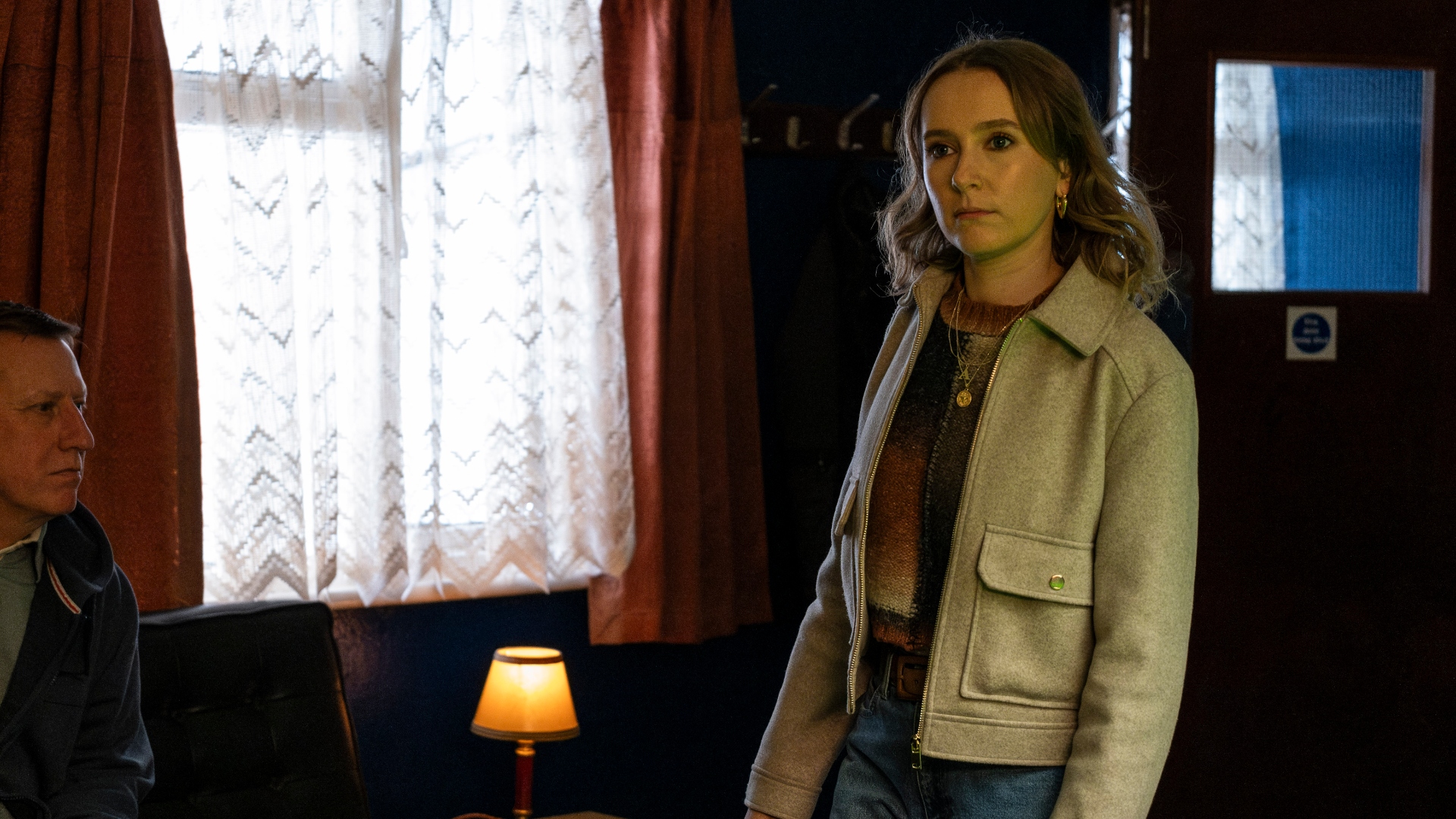 Alison stands in a pub in Code of Silence