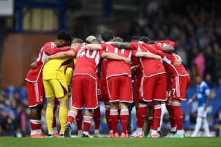 Nottingham Forest players in a huddle ahead of their Premier League game at Everton in April 2024.