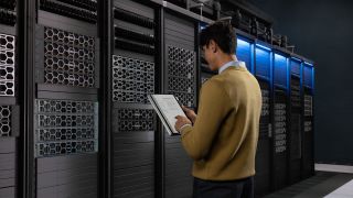 Dell servers with a person stood in front of them