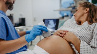 A pregnant woman undergoes an ultrasound