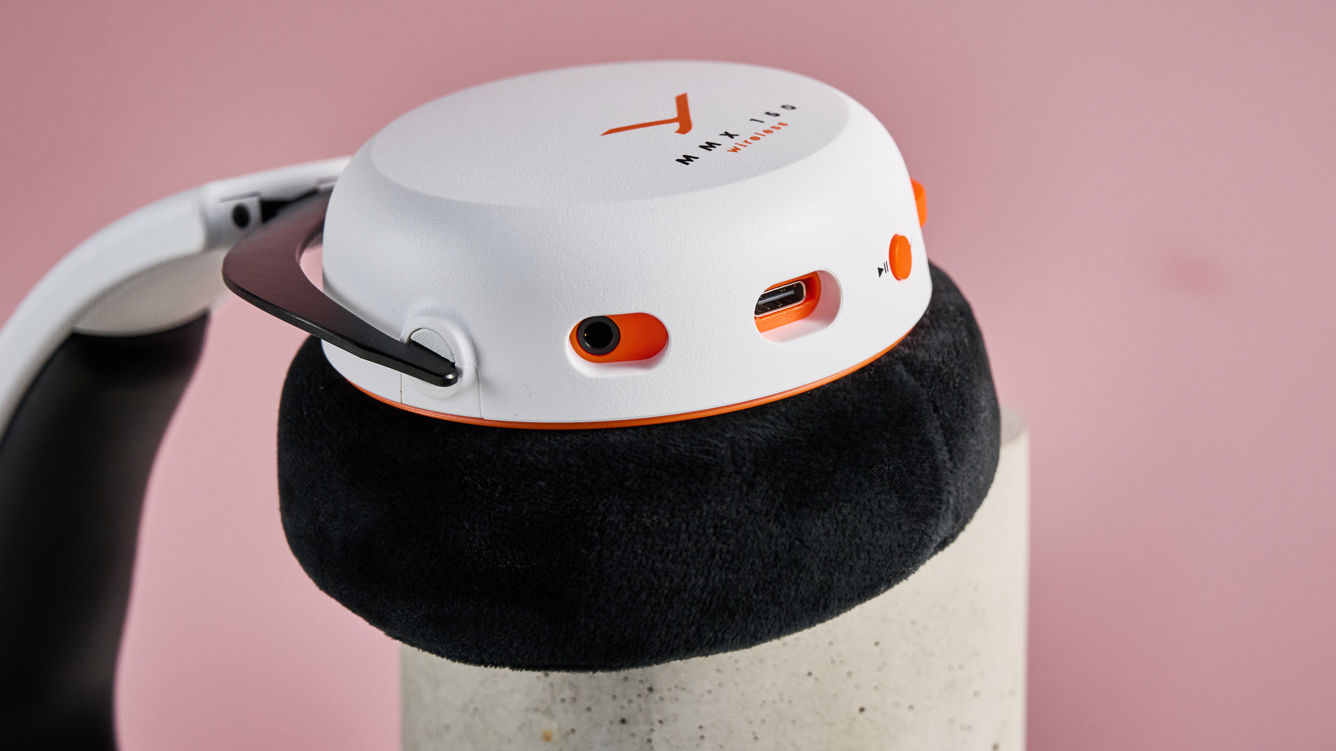 A closeup of the mic port, USB port and play button on the Beyerdynamic MMX 150 Wireless.