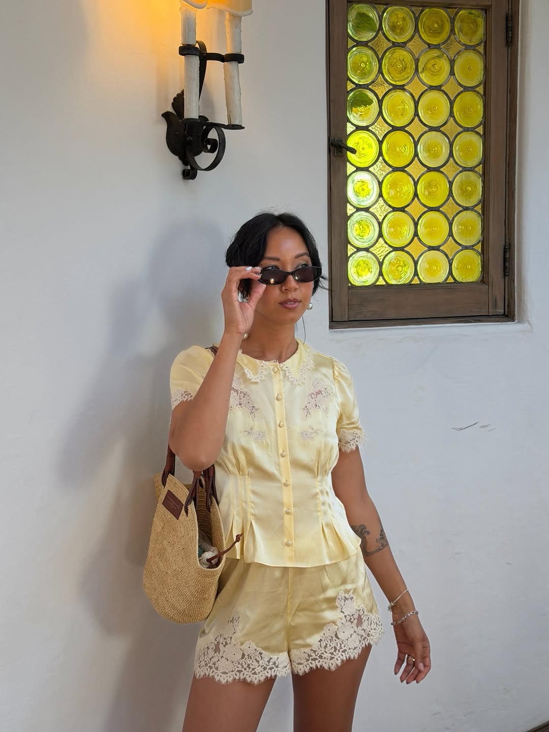 An image of woman wearing lace shorts, one of the biggest early summer 2026 micro trends.