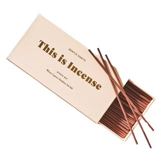 An open peach box of brown incense sticks