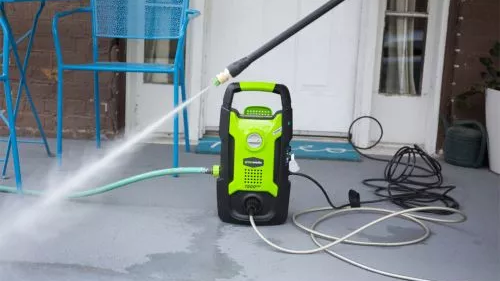 Greenworks GPW1501 unit with the spray gun in use