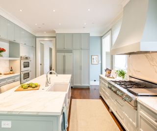 A blue and white kitchen with matching appliances