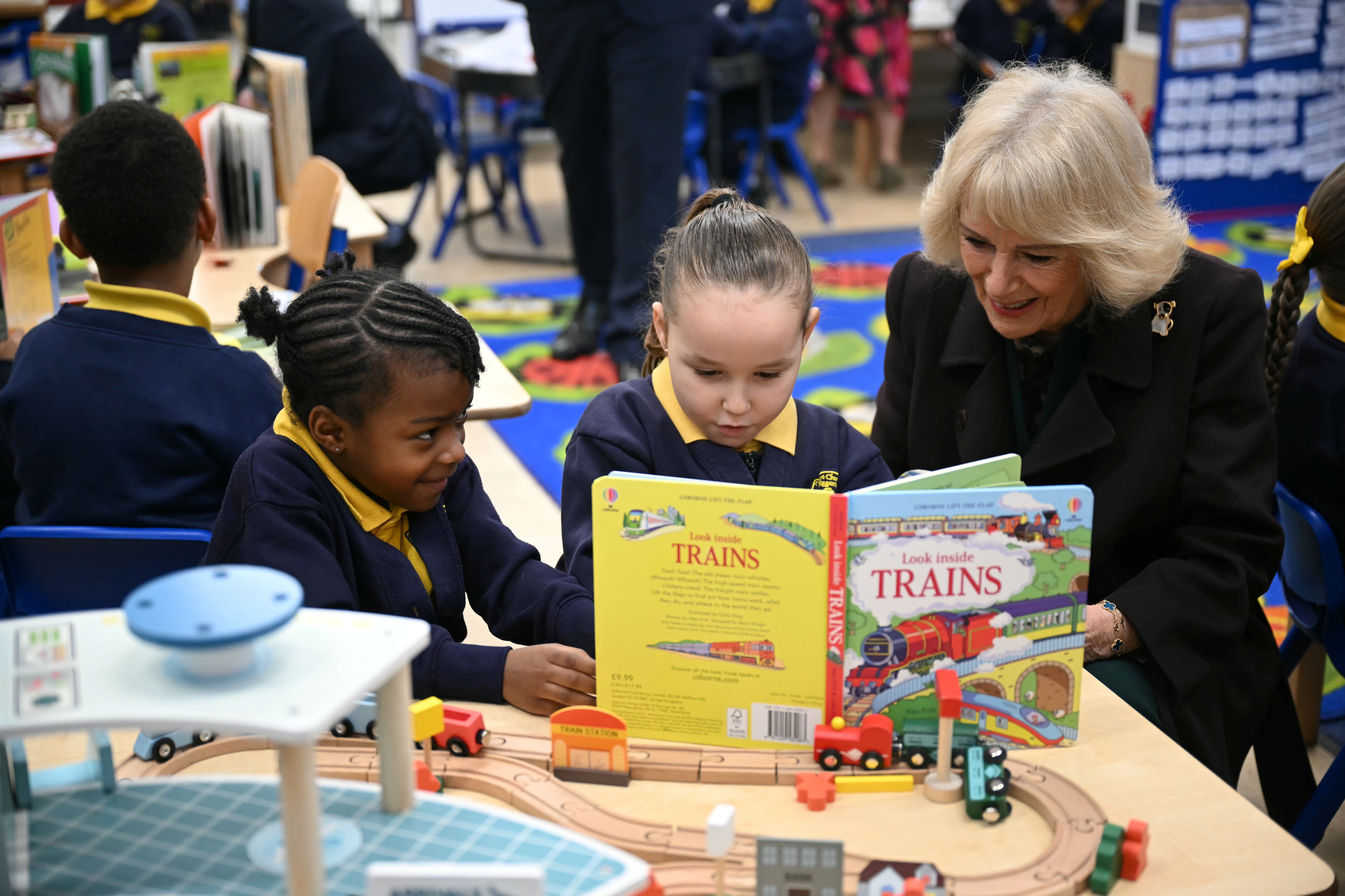 Queen Camilla meets with pupils as she attends the opening of a library at Christ Church Primary School to help mark the "National Year of Reading", on February 4, 2026 in London, England. (Photo by Justin Tallis - WPA Pool/Getty Images)