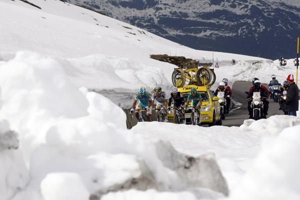 Riders make their way through the snow