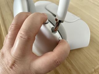 Reset AirPods Max to factory settings by showing: Press the Digital Crown and Noise Control buttons at the same time, hold for 15 seconds until status light flashes amber and then white