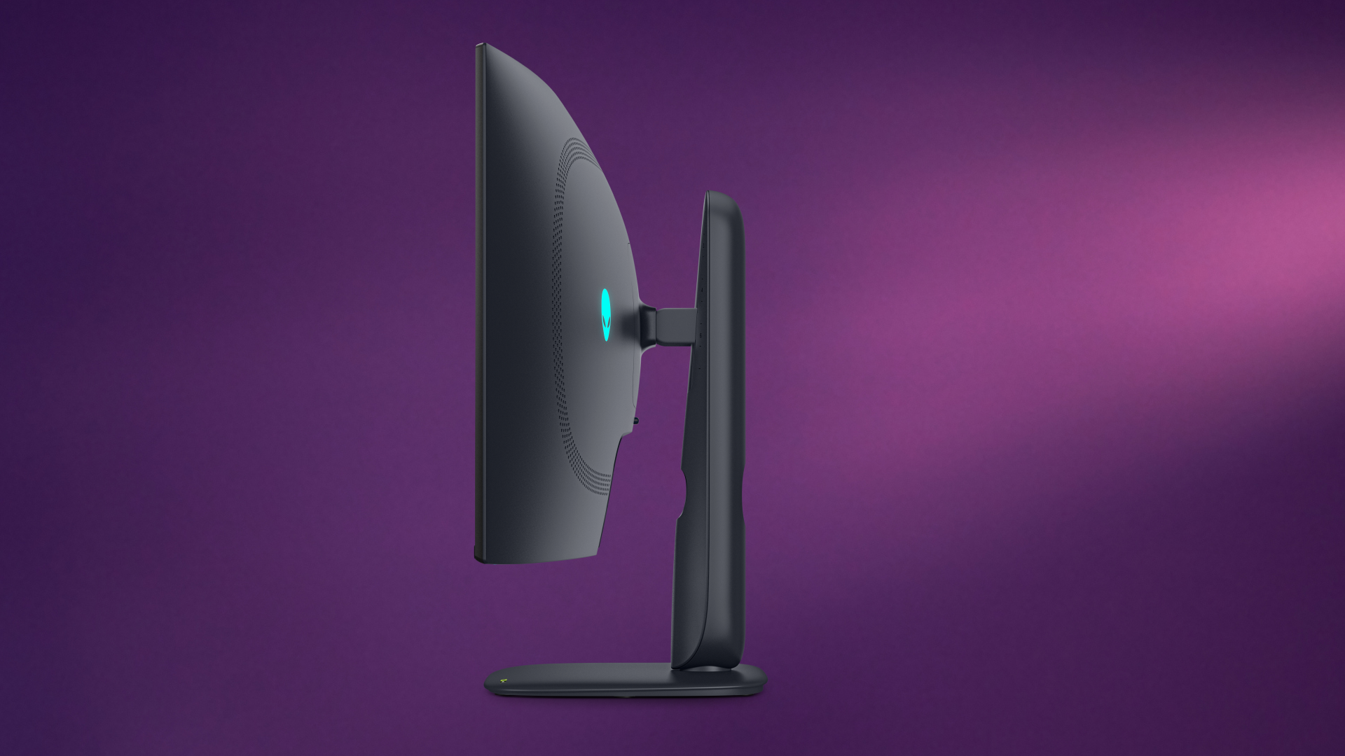 Side profile of the Alienware 39 5K OLED monitor in Nova Black, highlighting its 1500R curvature, thin profile, and height-adjustable stand.
