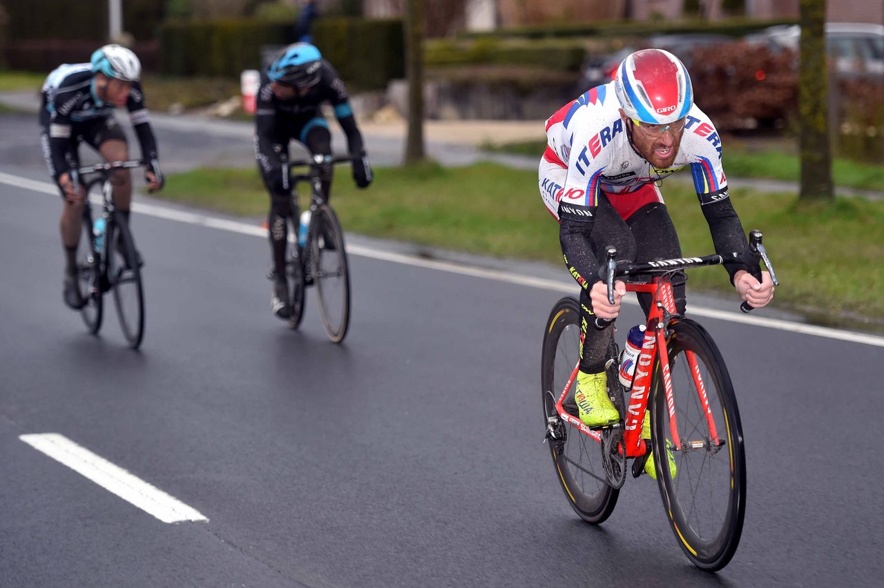 Luca Paolini (Katusha) attacks as Geraint Thomas (Team Sky) and Niki Terpstra (Etixx-Quick Step) look at each other