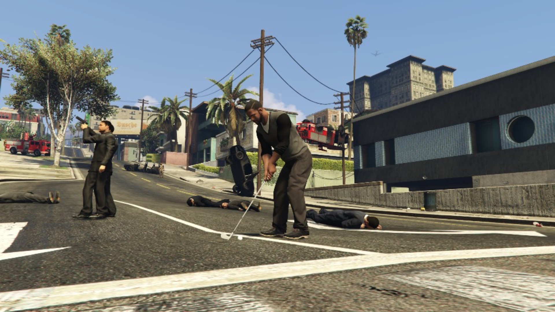 Franklin plays golf, surrounded by violence and chaos.