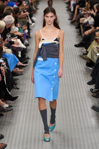 a runway image of the peep-toe shoe trend in the Miu Miu spring 2025 collection