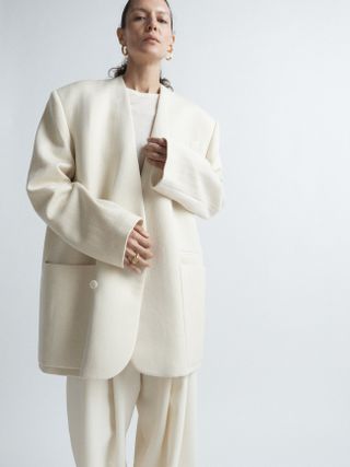 Giant wool herringbone collarless coat