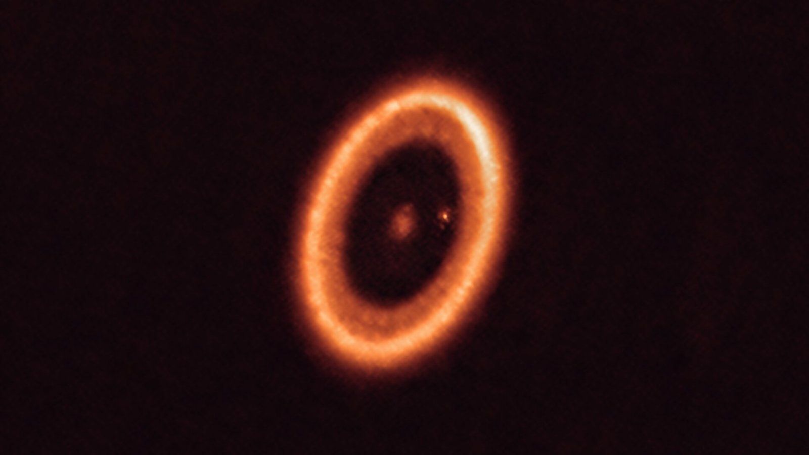 This photo of a moon-forming disc around an exoplanet puts Saturn to ...