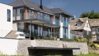 balconies on self build surrounded by glass decking balustrade