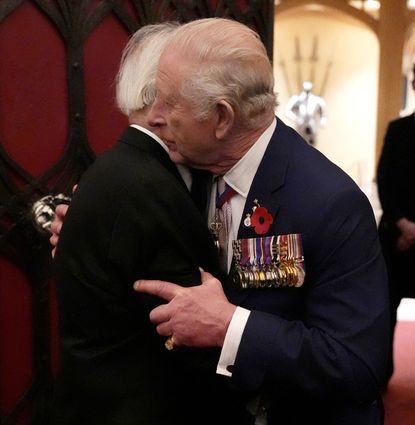 King Charles hugging a veteran