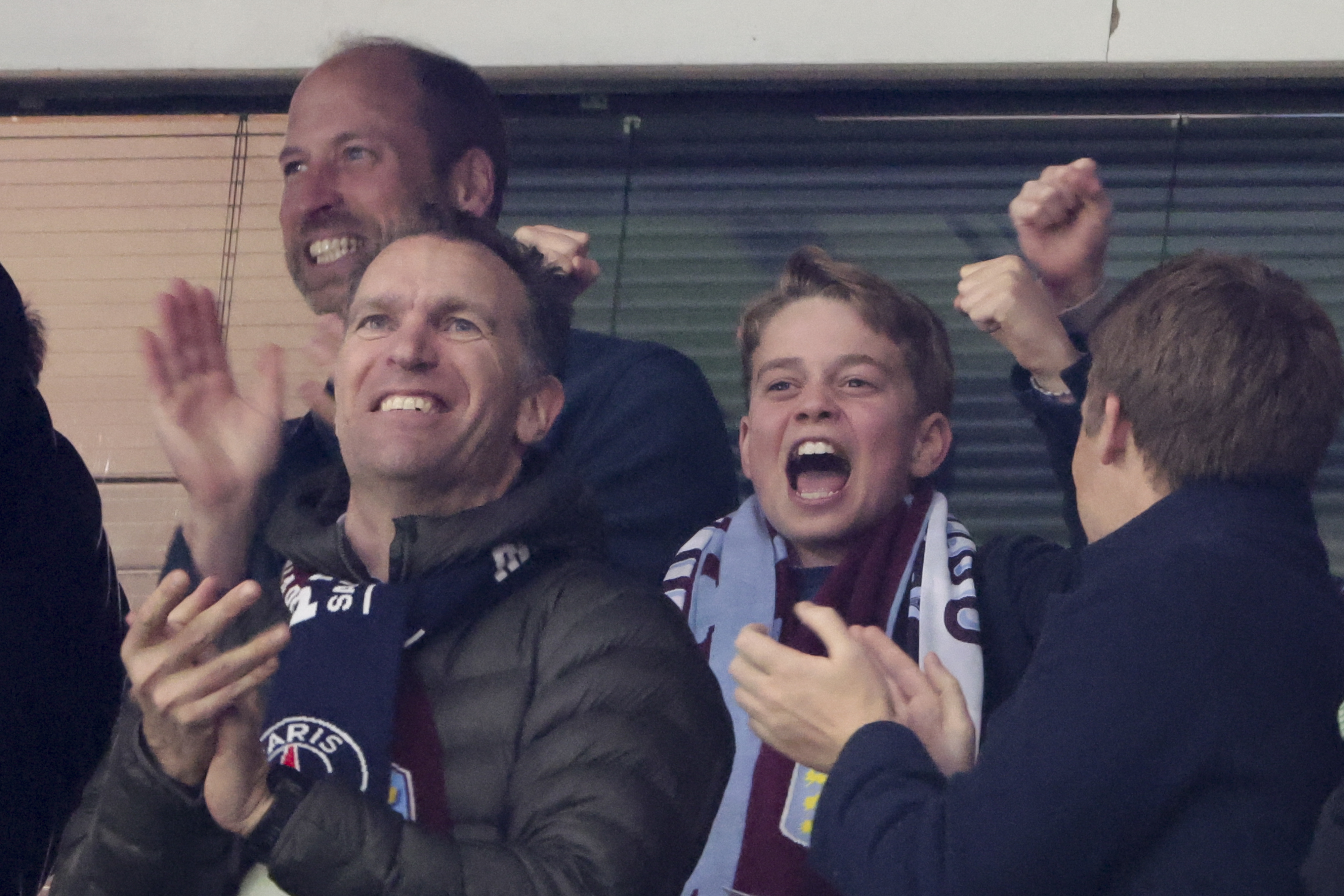 Prince William and Prince George cheering at an Aston Villa game in Paris 2025