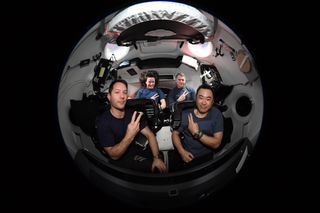 The four astronauts of NASA and SpaceX's Crew-2 mission pose inside their Crew Dragon Endeavour before leaving the International Space Station. They are: ESA astronaut Thomas Pesquet (front left); NASA astronaut Megan McArthur (back left); NASA astronaut Shane Kimbrough (back right); and JAXA astronaut Akihiko Hoshide.