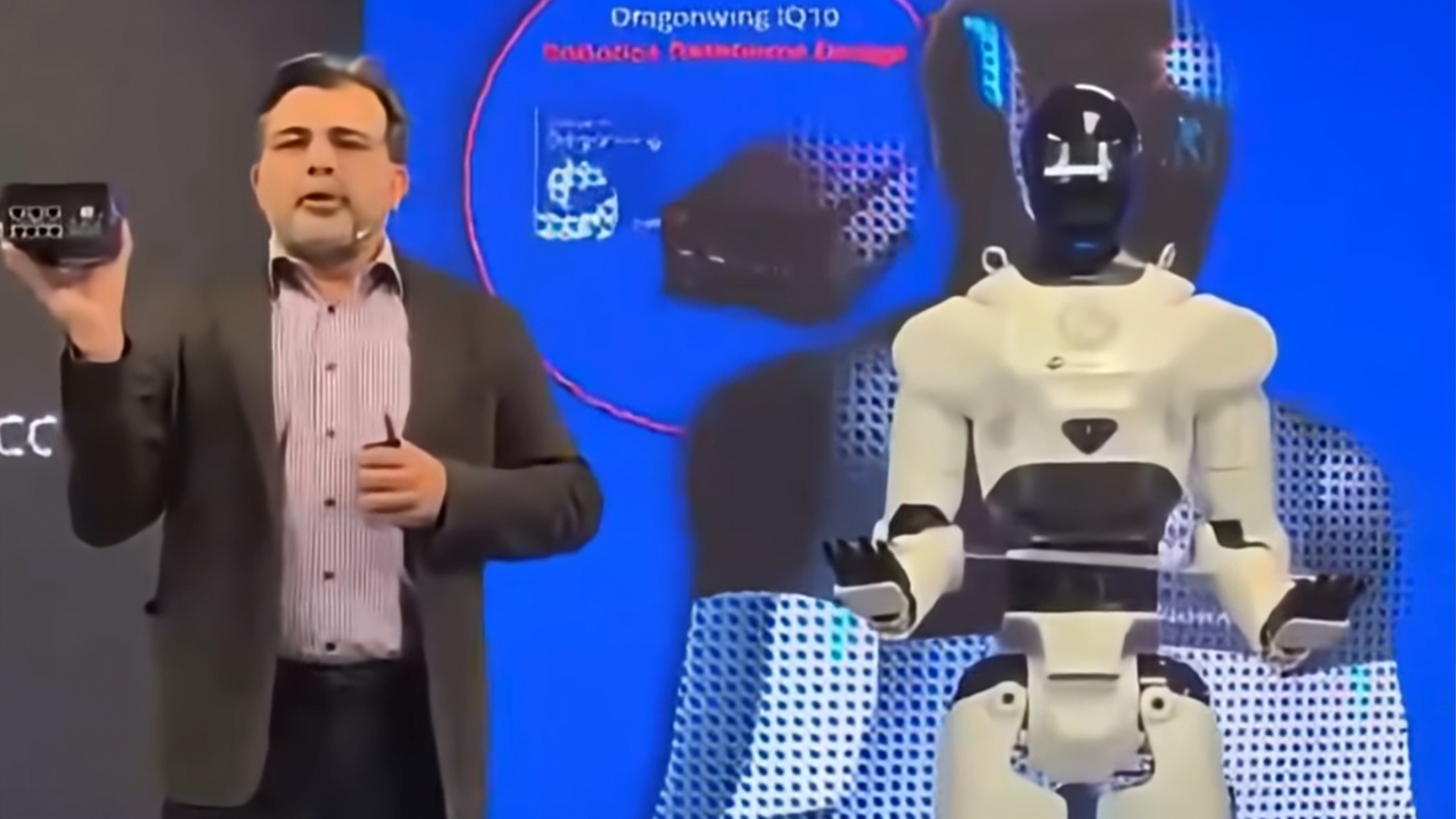 A Qualcomm robot standing on stage moments before collapsing
