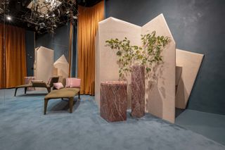 Changing Room at Teatro degli Arcimboldi with pink marble furniture and grey walls and carpets