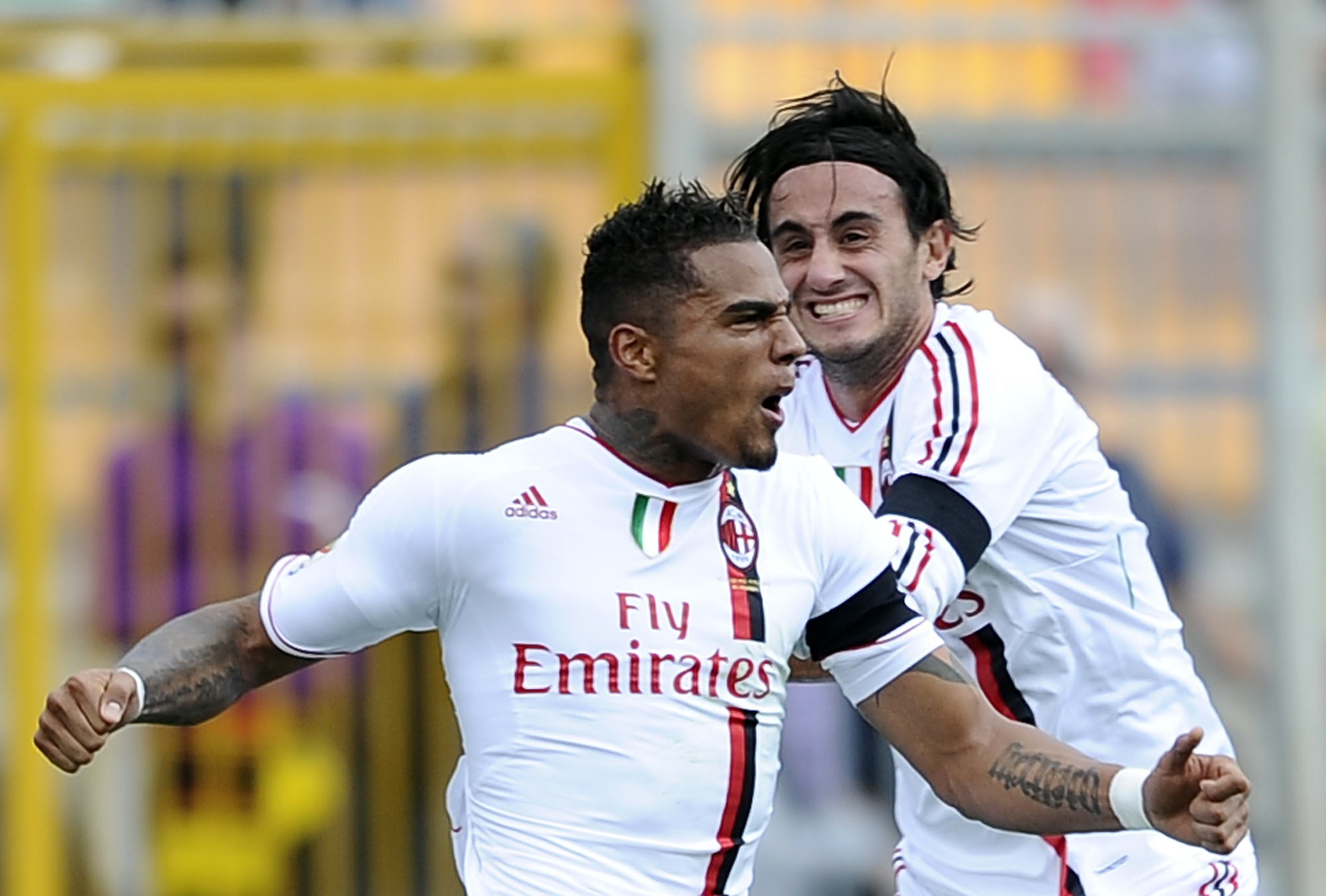 Kevin Prince Boateng celebrates with team-mate Alberto Aquilani after scoring for AC Milan against Lecce in October 2011.