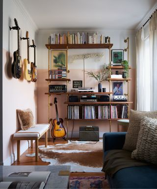 music room with guitars hung on wall and mid century modern interiors