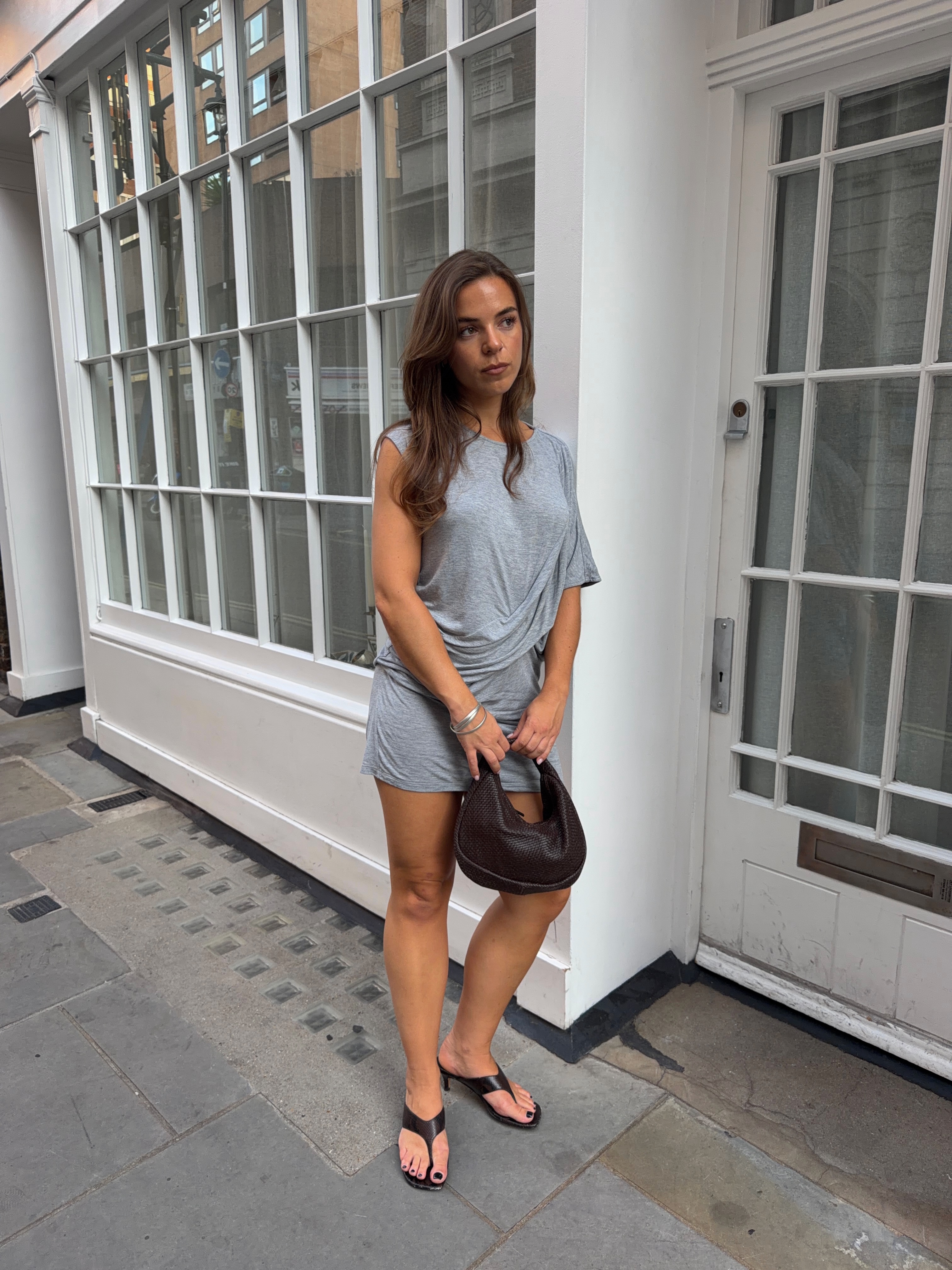 A woman wearing the thick-thong-sandal trend.