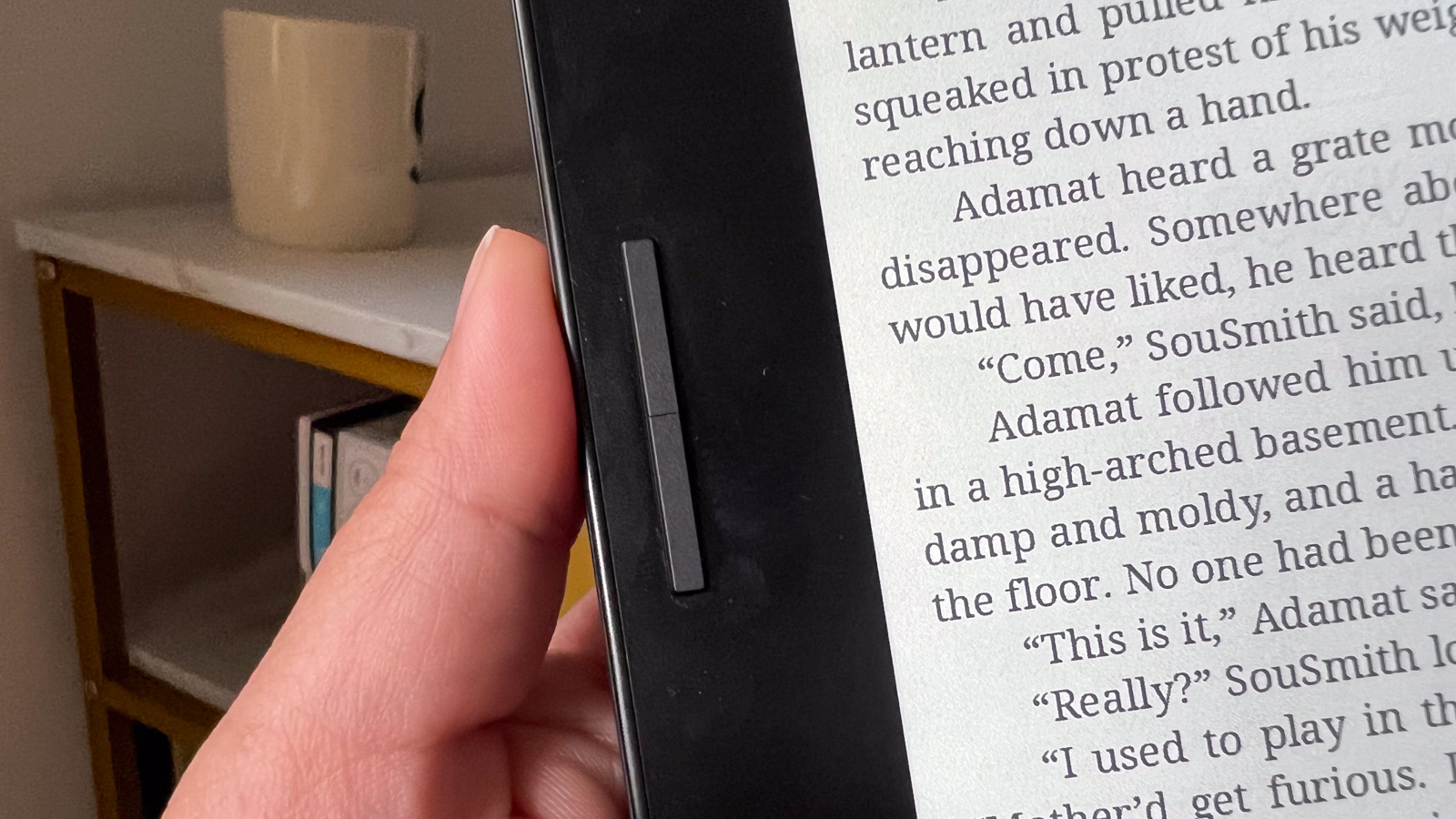 A thumb near the page-turn buttons of the Onyx Boox Go Color 7