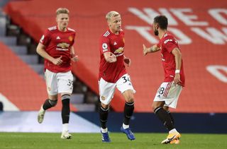 Manchester United’s Donny Van De Beek (centre) celebrates scoring his side’s first goal with his team-mates