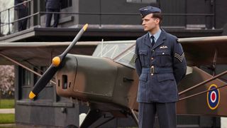 James Herriot in his RAF uniform next to a plane in All Creatures Great and Small season 5