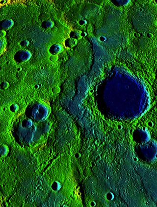 A belt of ridges and scarps stretches 336 mile (540 km) across the surface of Mercury. The colors correspond to elevation, with yellow-green revealing higher spots and blue revealing low.