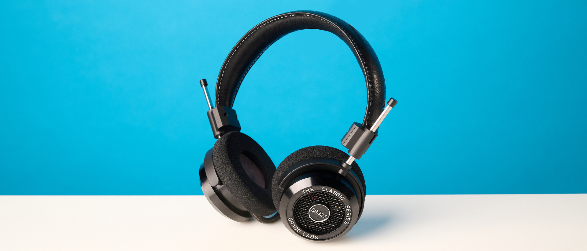Grado SR325 photographed in front of a blue background