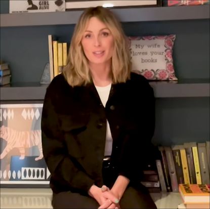 Jessica Knoll sitting in front of her bookshelf 