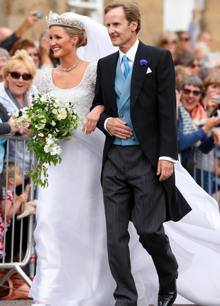 Lady Melissa Percy escorted by her father Ralph Percy, Duke of Northumberland arrive at St Michael's Church for her wedding on June 22, 2013 in Alnwick, England