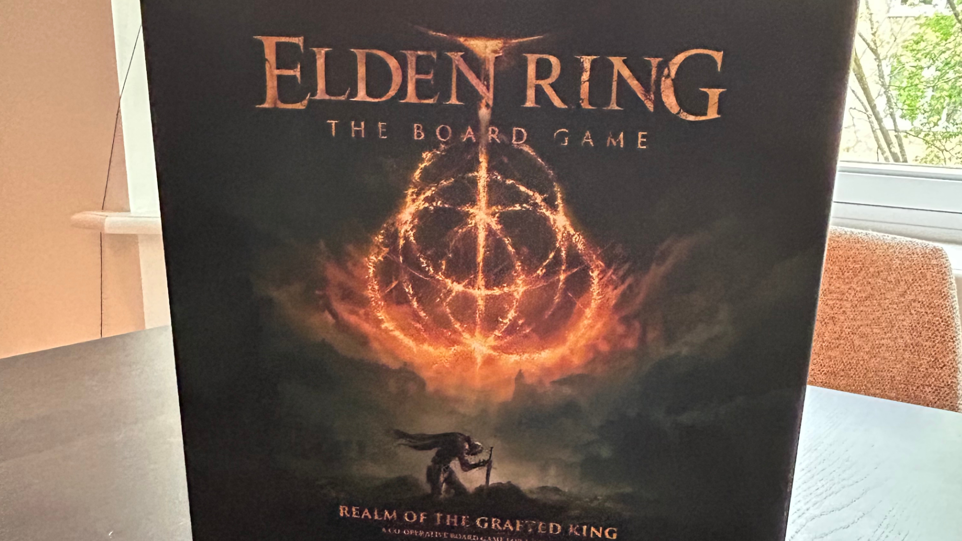 Elden Ring: The Board Game - Realm of the Grafted King box on a wooden table
