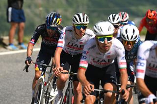 UAE Team Emirates riders pace team leader Tadej Pogačar (second from left) on Col du Galibier climb, with GC contenders Primož Roglič (left) and Jonas Vingegaard (right) trying to tag along