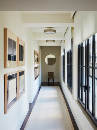 a modern hallway with semi-flush lighting