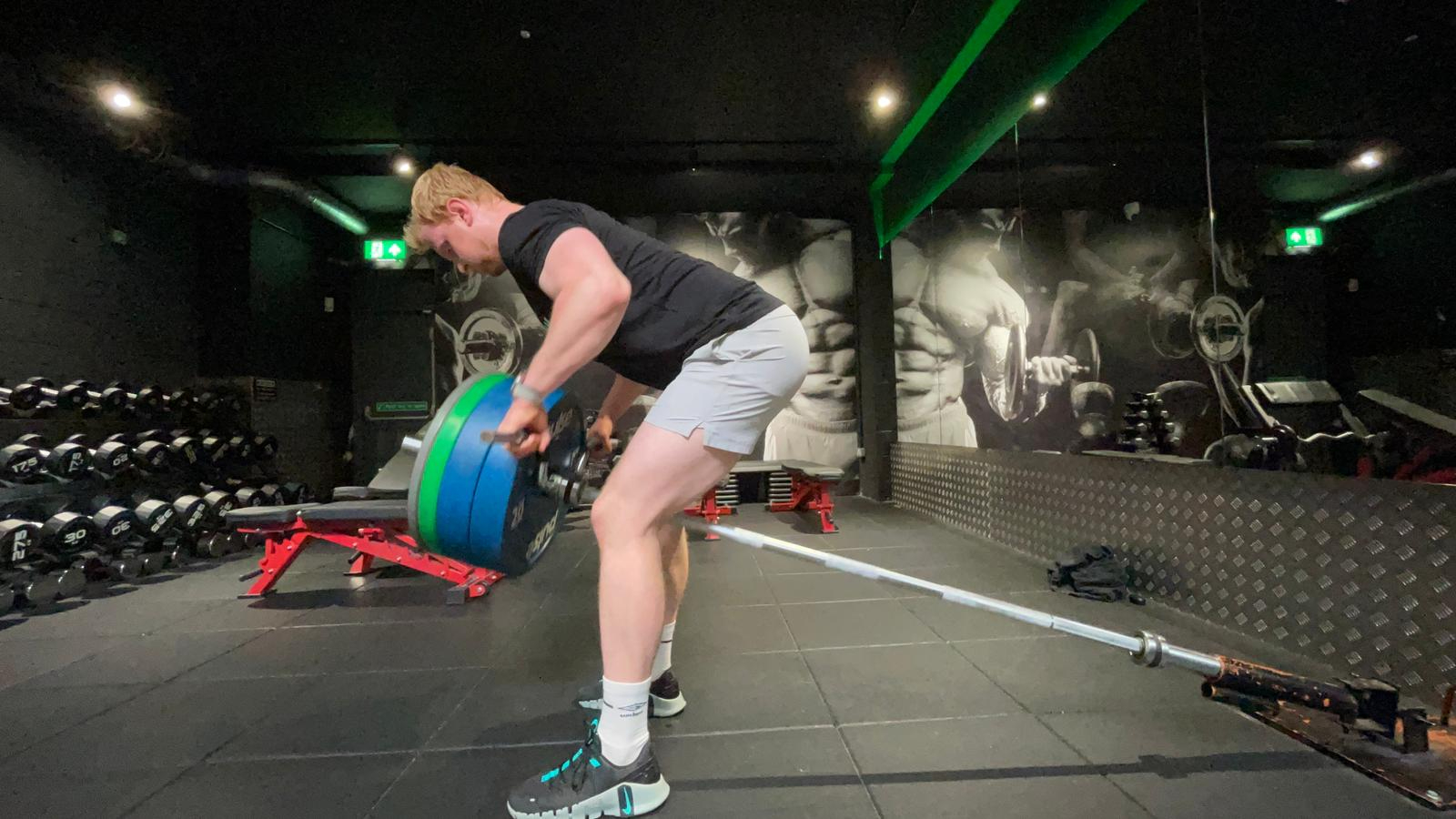 TechRadar fitness writer Harry Bullmore working out with Arnold Schwarzenegger's The Pump app