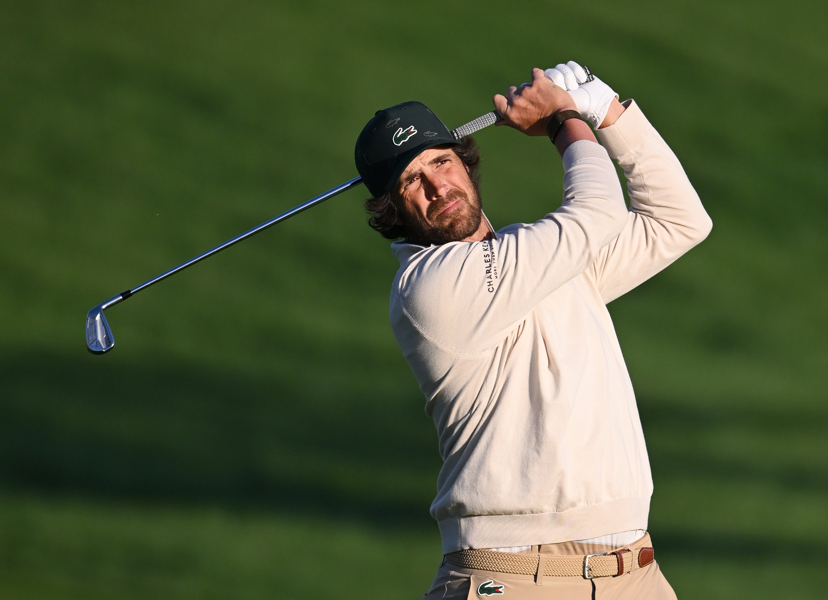 Nacho Elvira hits an iron shot from the fairway