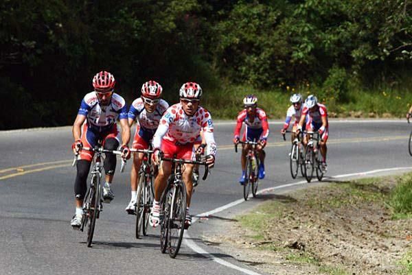 The rider in the polka dot jersey pushes the pace of his fellow riders.