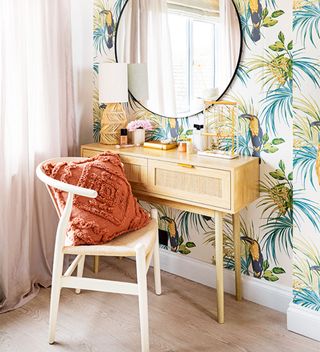 walk in dressing room with dressing table and tropical wallpaper
