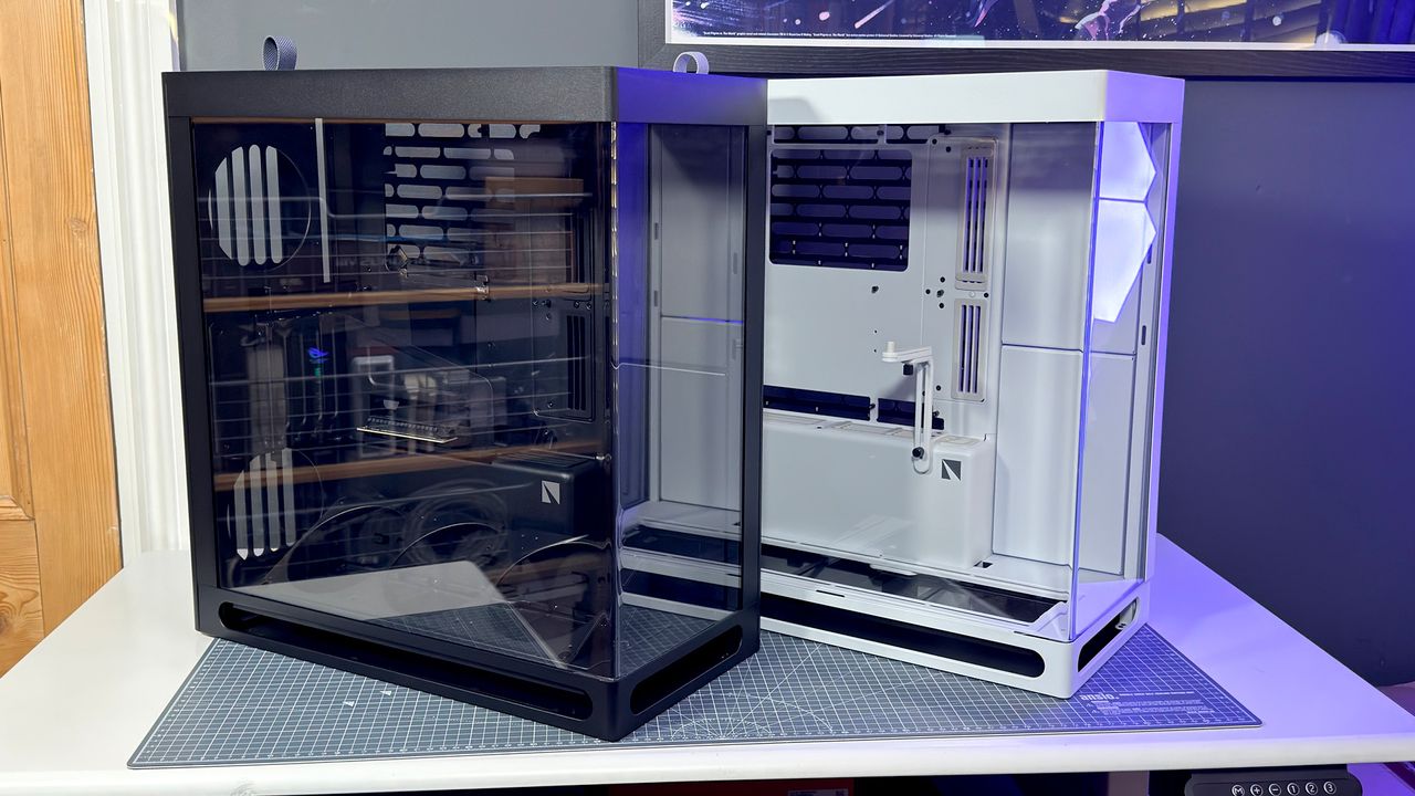 The Havn HS 360 PC case in black and white on a desk.