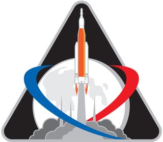 NASA's Exploration Mission-1 (EM-1) mission patch represents the future first launch of the Space Launch System (SLS) heavy-lift rocket.