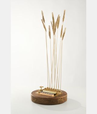 timepiece comprising circular base and stems resembling wheat