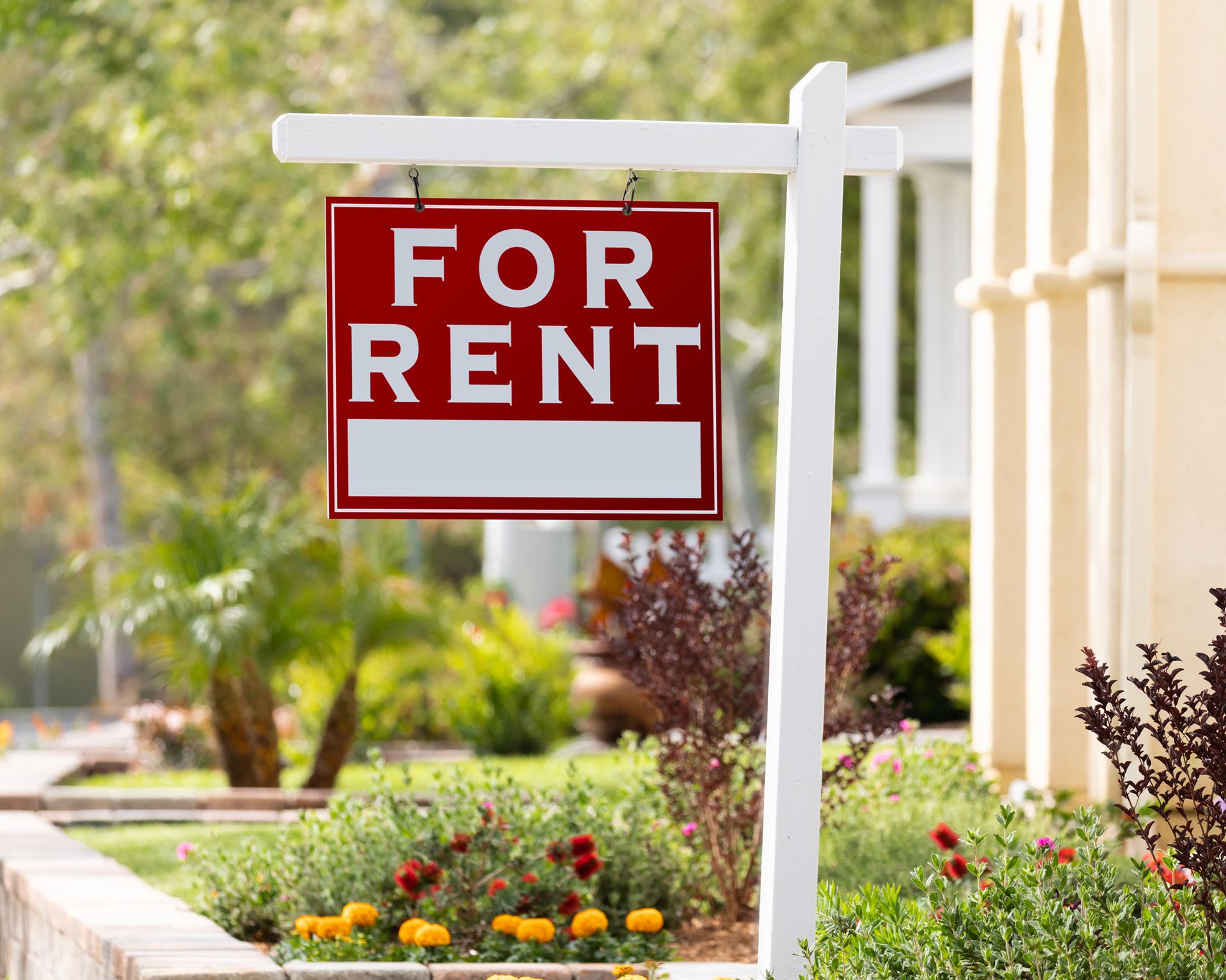 Red for rent sign outside a rental home