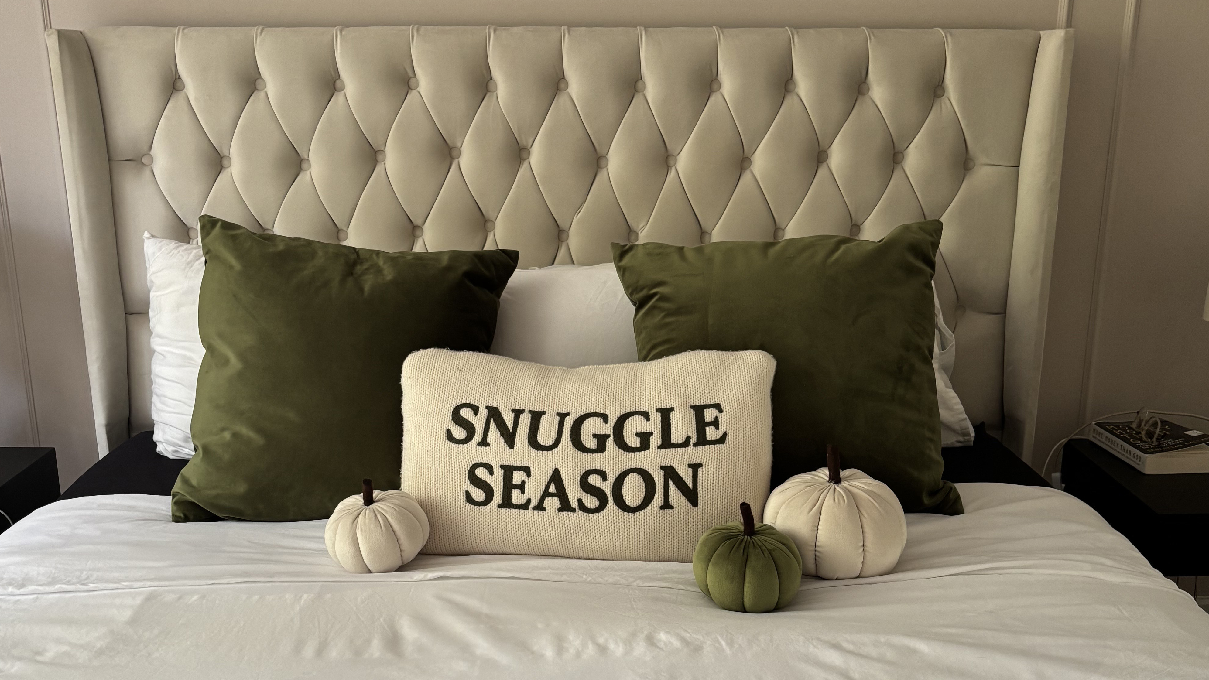 bed with pumpkin cushions on it