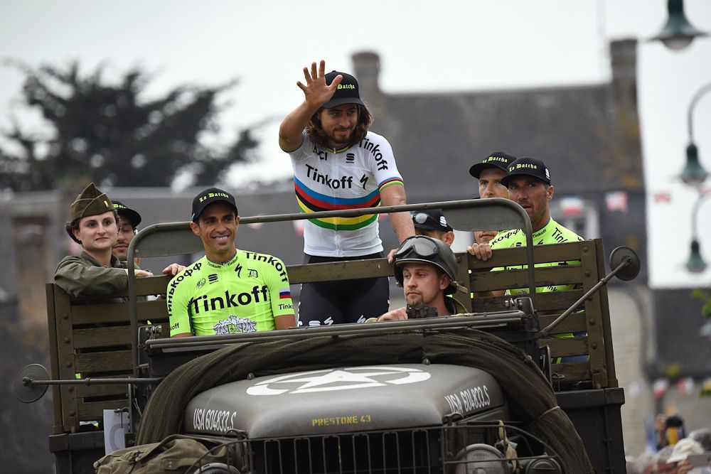 World champion Peter Sagan waves to the crowd as Alberto Contador looks on.