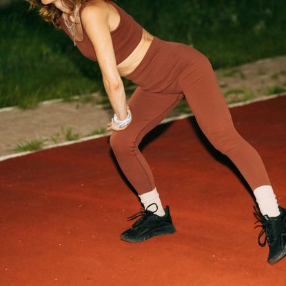 How to run faster: A woman warming up before a workout