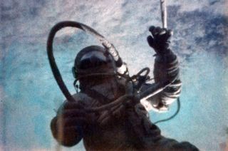 First spacewalker Alexei Leonov of the former Soviet Union was attached to his Voskhod 2 spacecraft by an 18-foot-long umbilical cable.